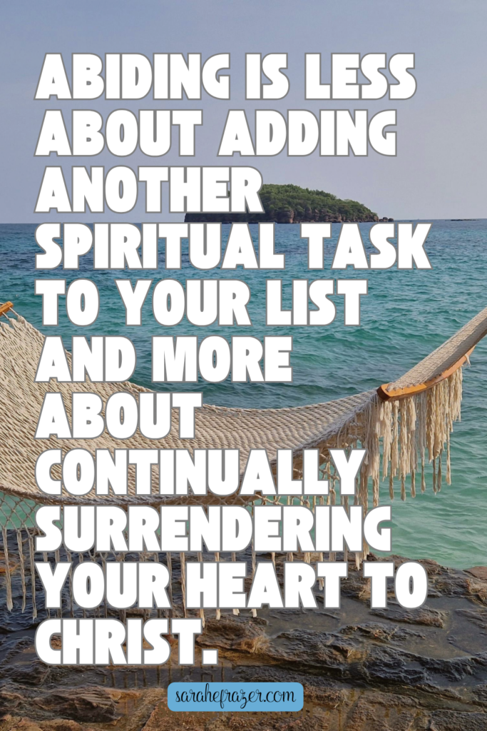 abiding quote on background of a white hammock overlooking the ocean