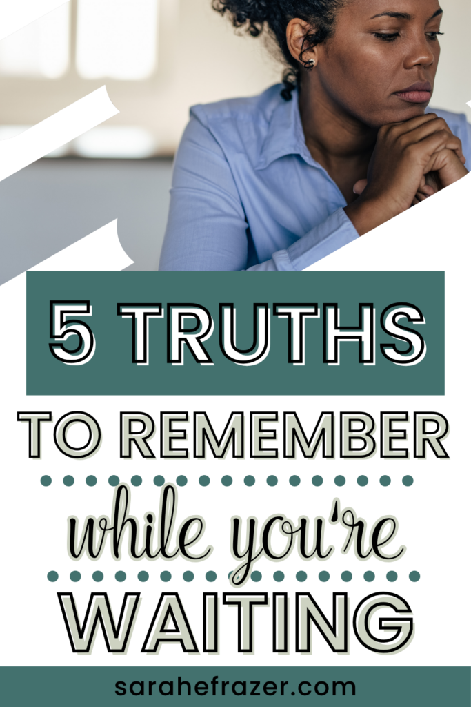 a woman with dark curly hair and a blue shirt closes her eyes in prayer. Text reads: 5 truths to remember while you're waiting