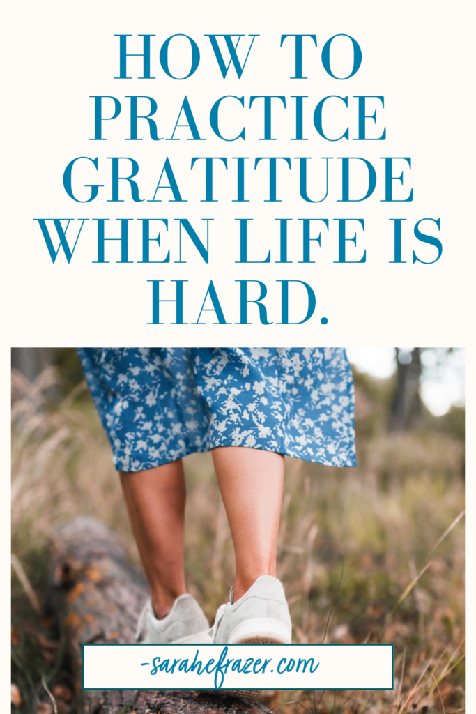 woman in white and blue skirt and white tennis shoes walks across a long. Text reads: how to practice gratitude when life is hard