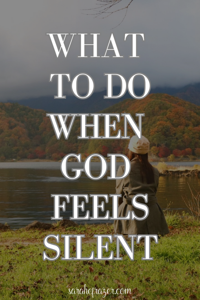 women in flannel sits looking out onto lake in the fall. Text reads: what to do when God feels silent