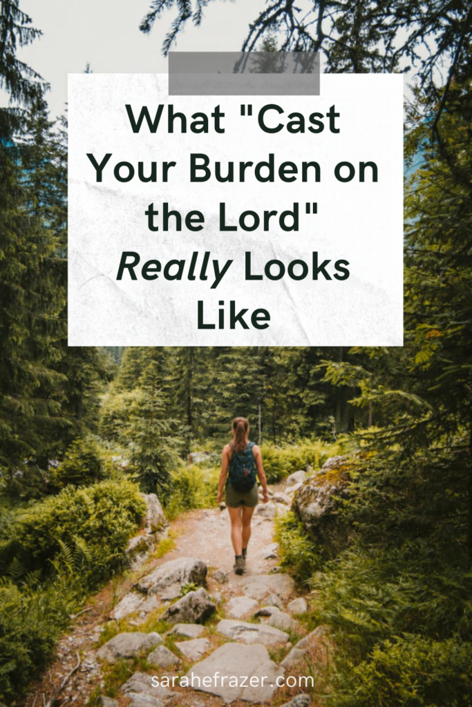 What cast your burden on the Lord really looks like" text overlay with image of a woman hiking on a trail with a pack on her back